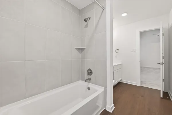a bathroom with a bathtub and a shower