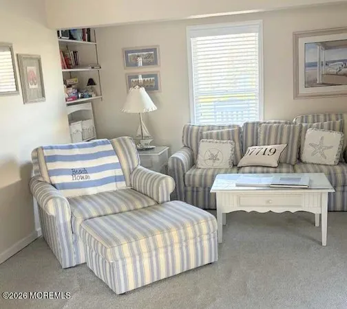 a bedroom with two beds and a large mirror