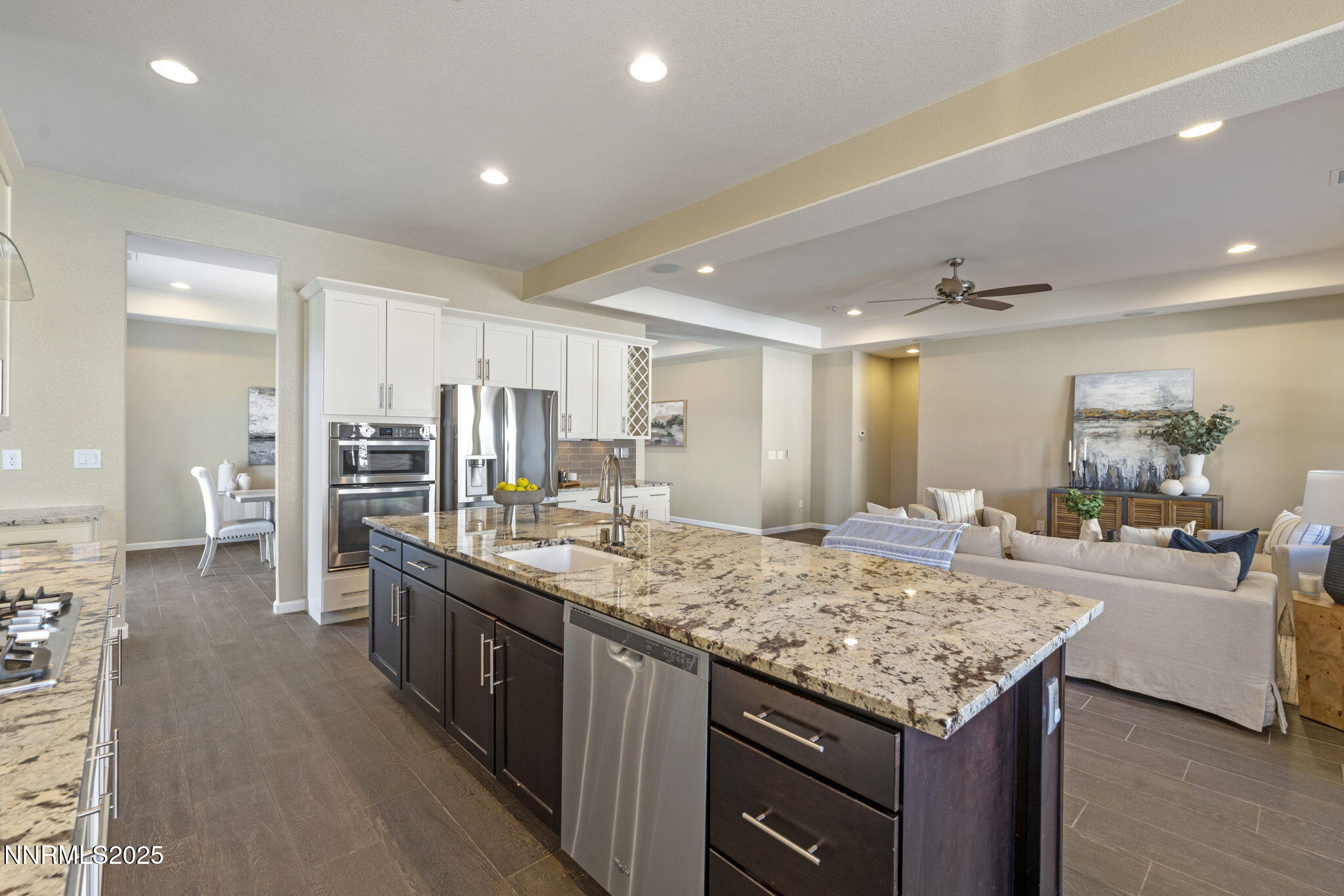 1755 Back Nine Trail Reno, NV 89523 - Photo 15 of 49 a kitchen with center island and stainless steel appliances