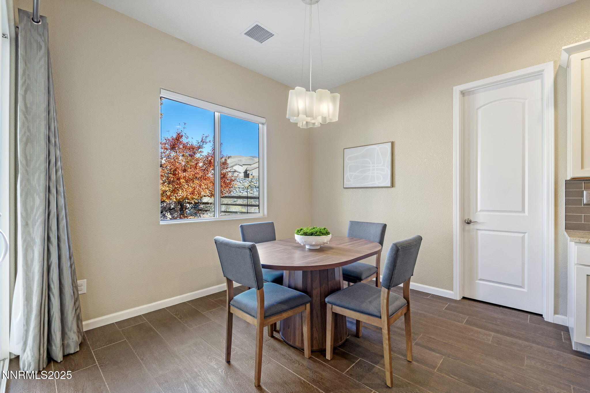 1755 Back Nine Trail Reno, NV 89523 - Photo 18 of 49 a view of a dining room with furniture wooden floor and a chandelier