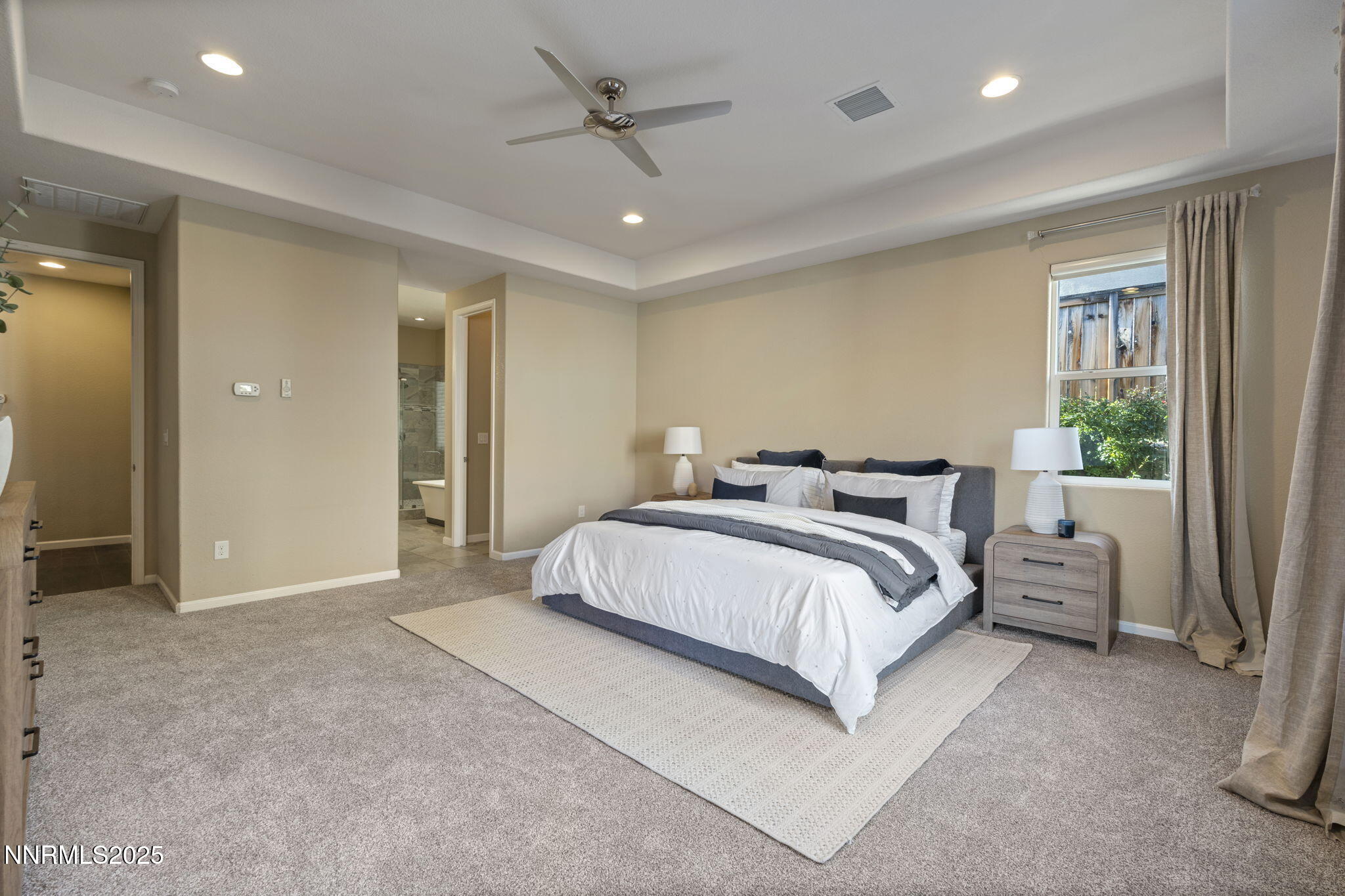 1755 Back Nine Trail Reno, NV 89523 - Photo 26 of 49 a spacious bedroom with a bed and a dresser