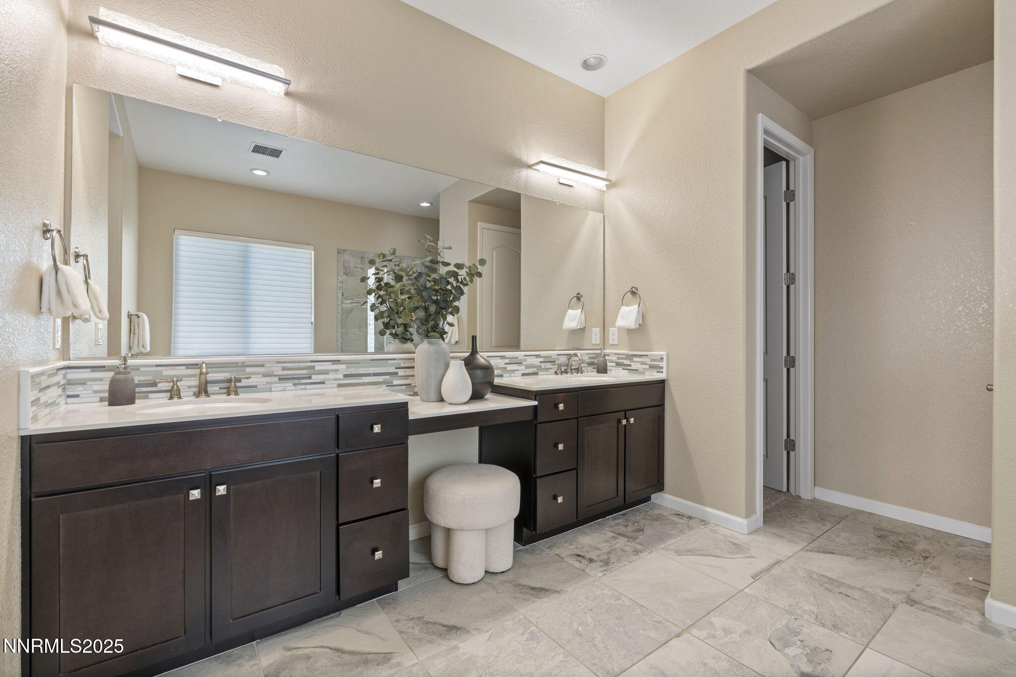 1755 Back Nine Trail Reno, NV 89523 - Photo 27 of 49 a bathroom with a granite countertop sink a toilet and a mirror