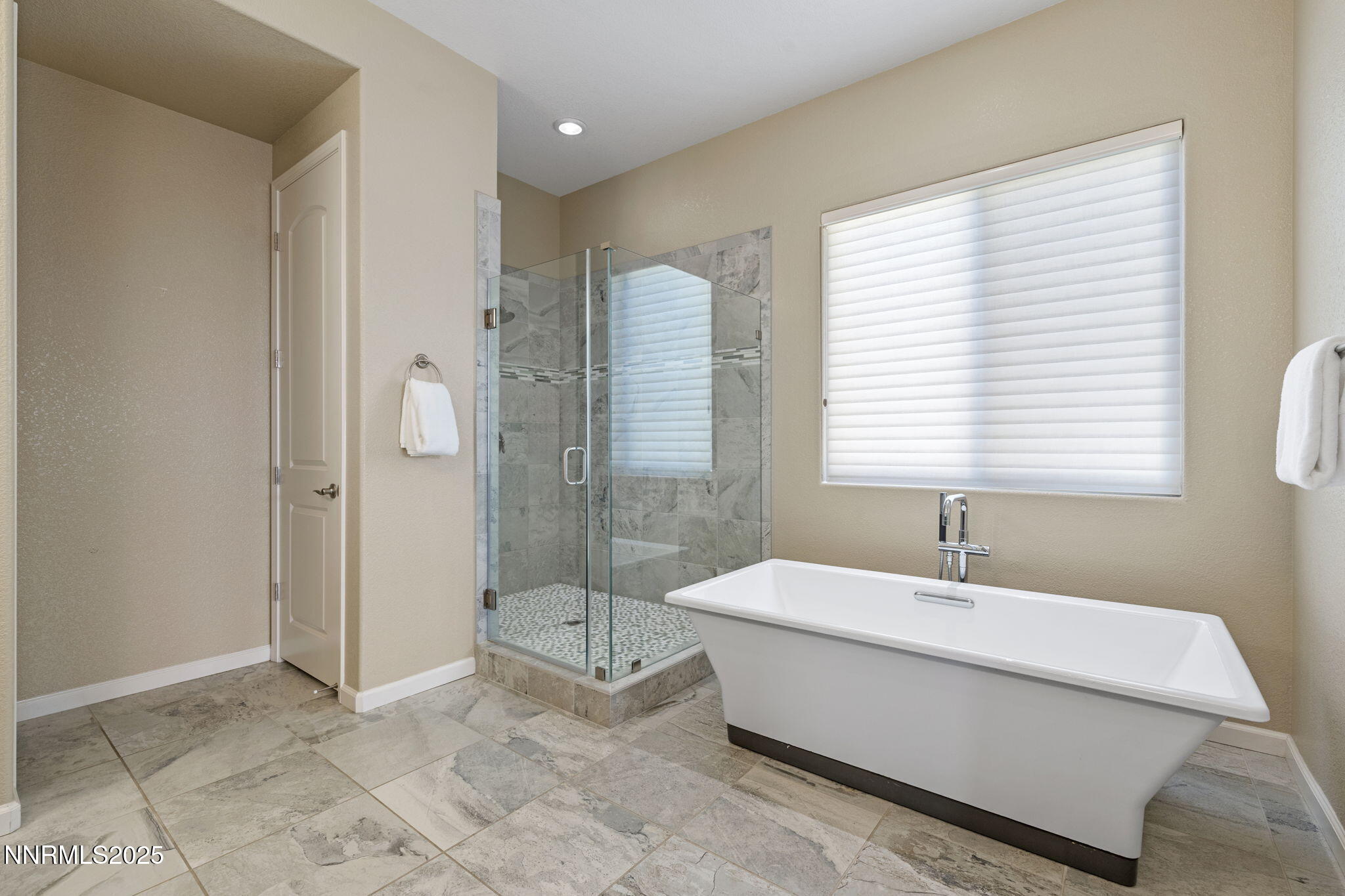 1755 Back Nine Trail Reno, NV 89523 - Photo 29 of 49 a bathroom with a tub a sink and a shower