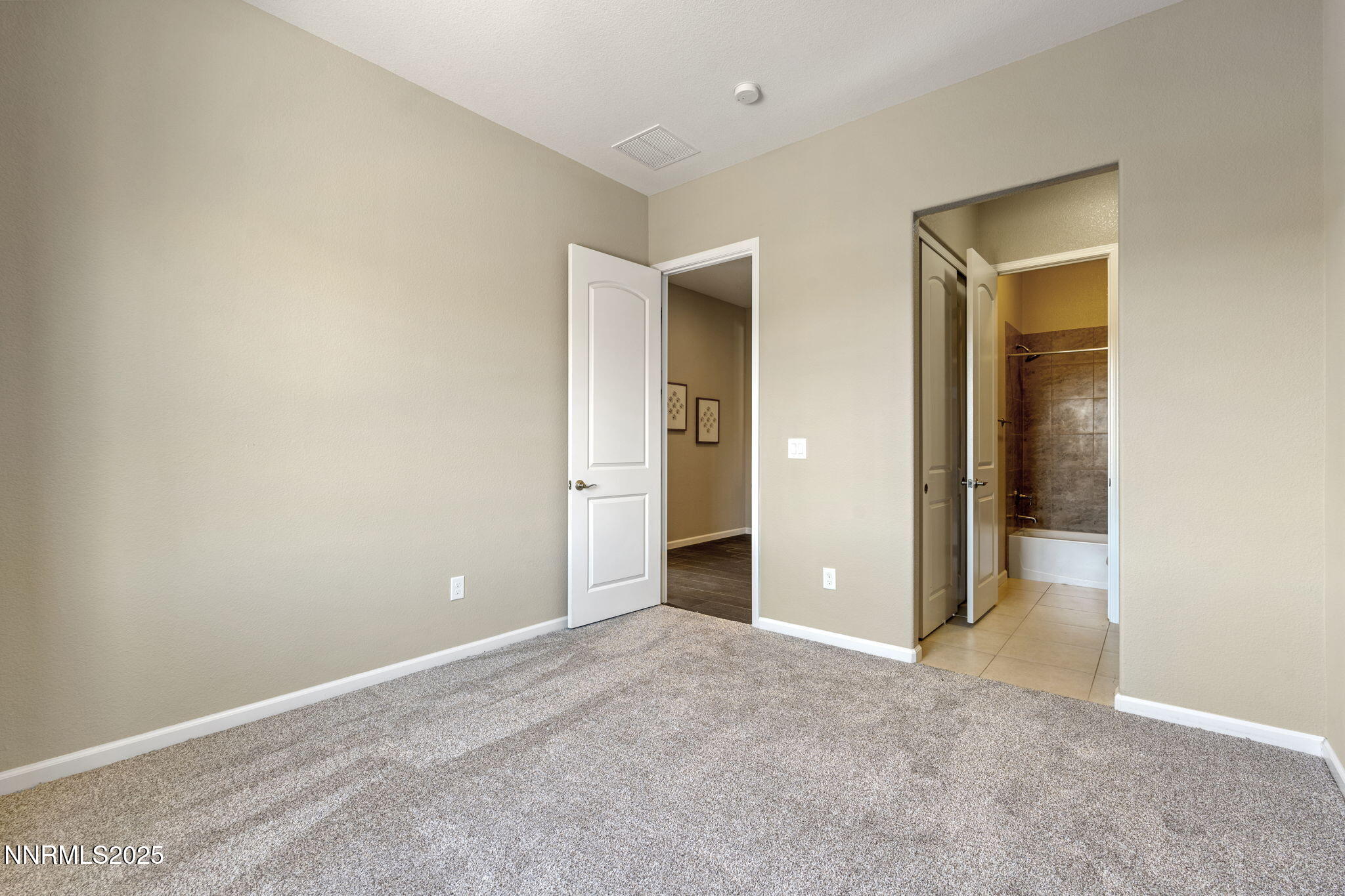 1755 Back Nine Trail Reno, NV 89523 - Photo 32 of 49 an empty room with closet and a bathroom