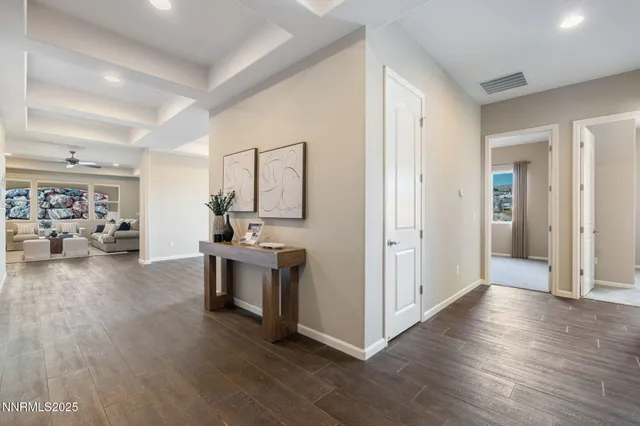 a view of a kitchen with furniture and wooden floor