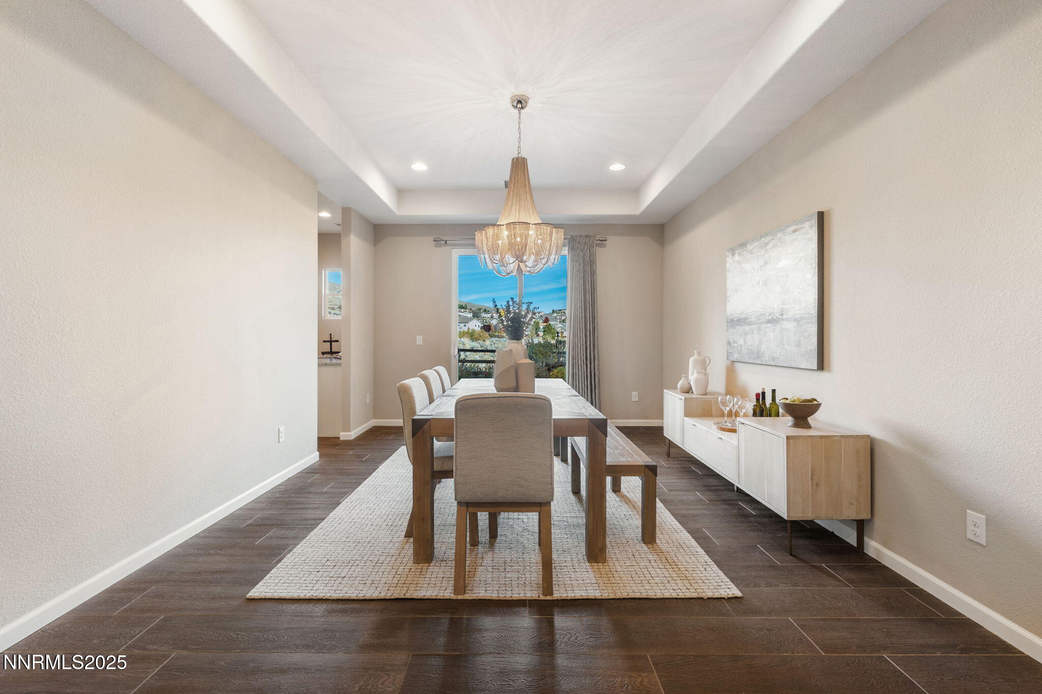 1755 Back Nine Trail Reno, NV 89523 - Photo 6 of 49 a dining room with wooden floor a chandelier a wooden table and chairs
