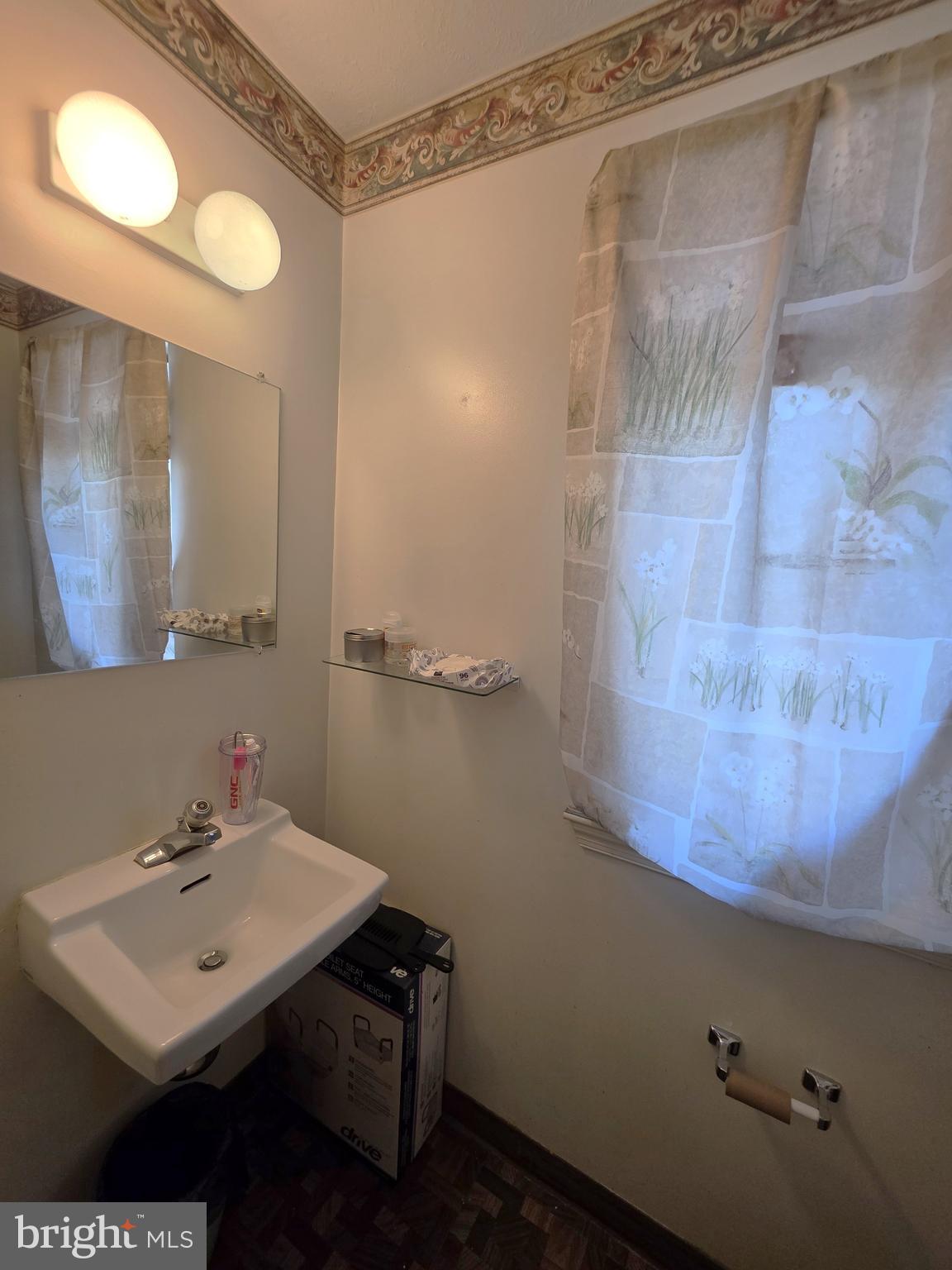 7103 Split Rail Lane Laurel, MD 20707 - Photo 4 of 6 a bathroom with a sink mirror and a shower
