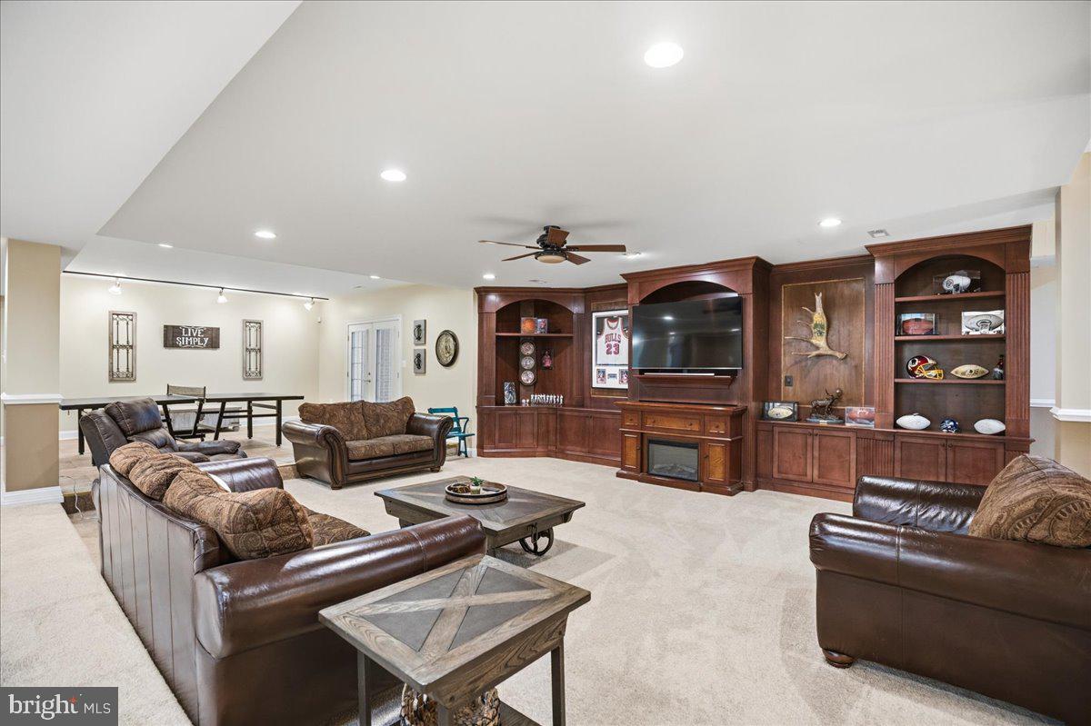 4100 Hidden Creek Road Port Republic, MD 20676 - Photo 86 of 99 TV, fireplace, ping pong, billiards, foosball