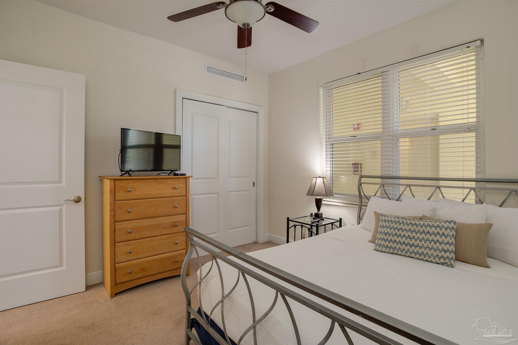 645 Lost Key Drive, Unit 206D Perdido Key, FL 32507 - Photo 12 of 60 a bedroom with a bed and furniture