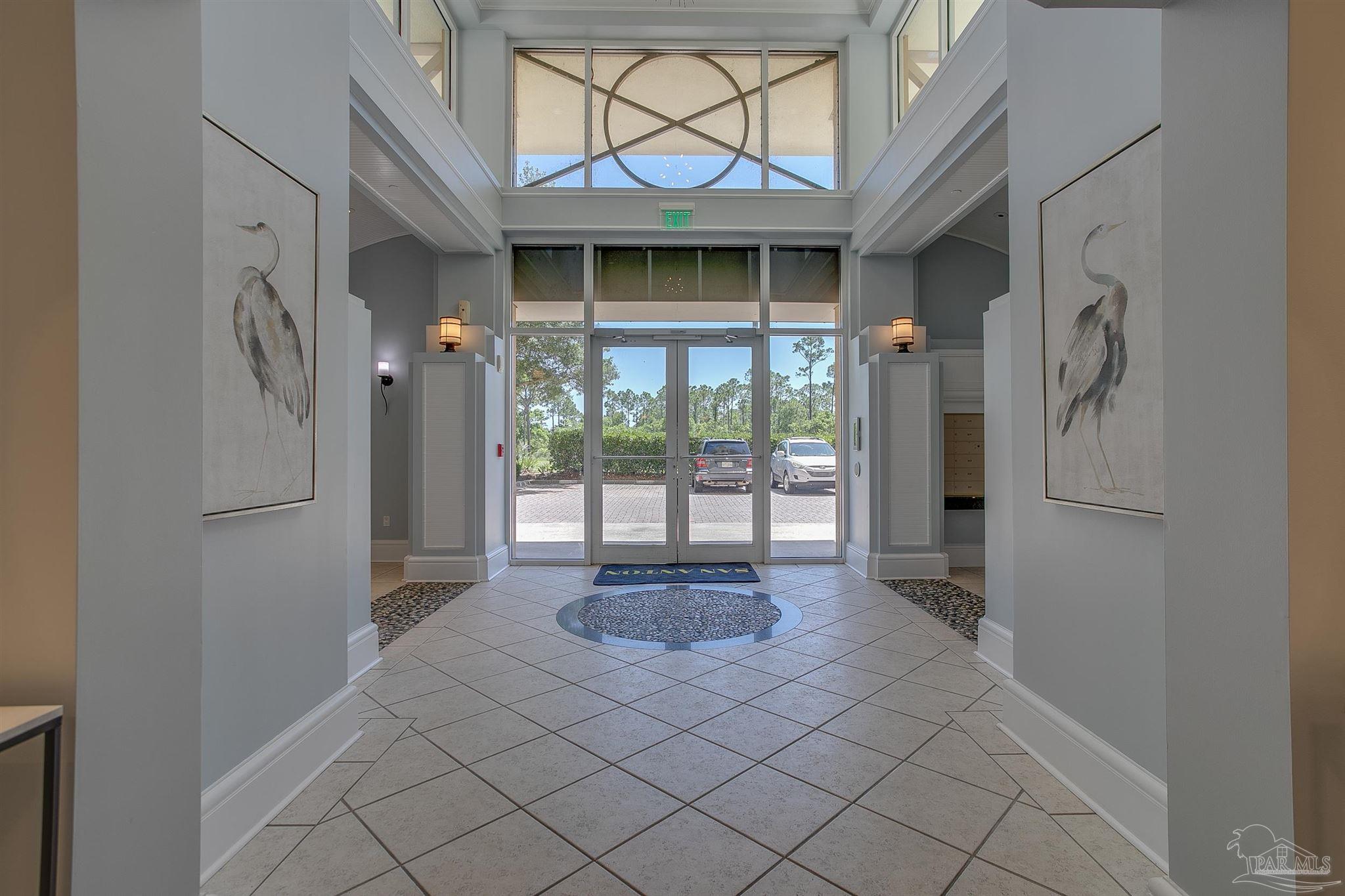 645 Lost Key Drive, Unit 206D Perdido Key, FL 32507 - Photo 12 of 72 a hallway with sliding door and front door