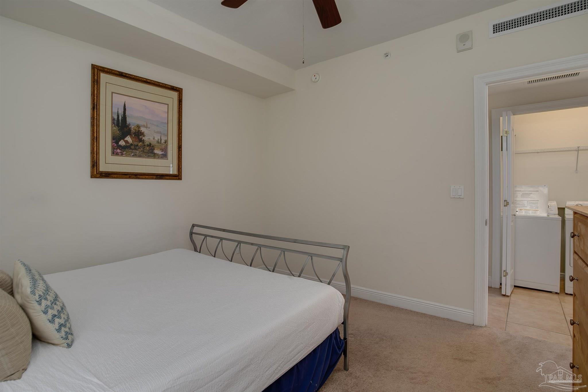 645 Lost Key Drive, Unit 206D Perdido Key, FL 32507 - Photo 13 of 60 a bedroom with a bed and a painting on the wall