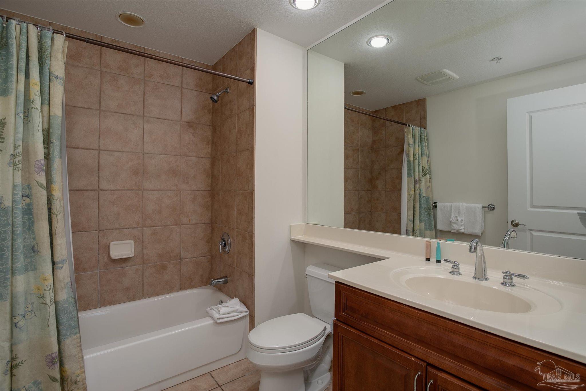 645 Lost Key Drive, Unit 206D Perdido Key, FL 32507 - Photo 15 of 60 a bathroom with a sink a toilet and shower
