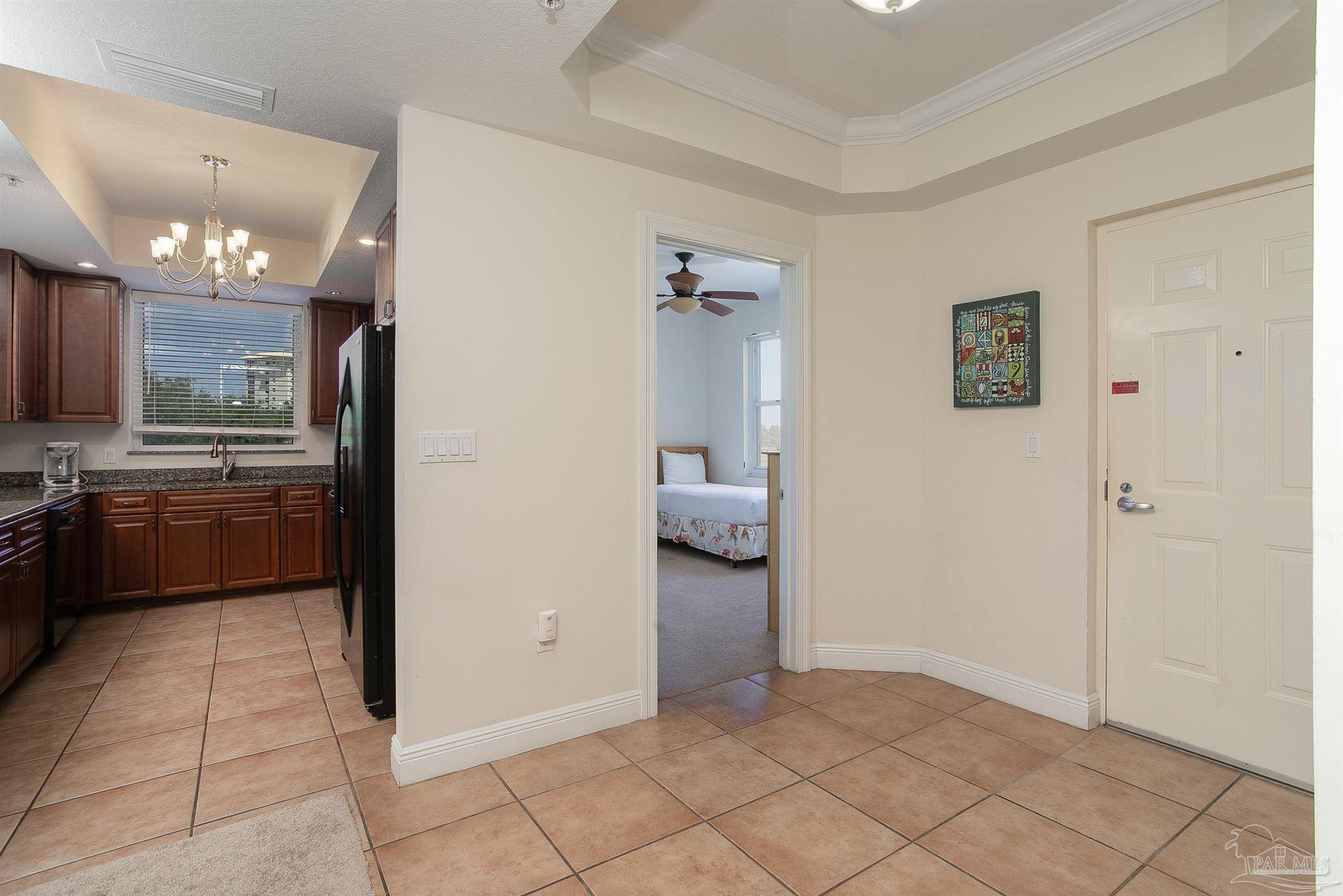 645 Lost Key Drive, Unit 206D Perdido Key, FL 32507 - Photo 17 of 60 a view of a kitchen with a refrigerator and a stove top oven