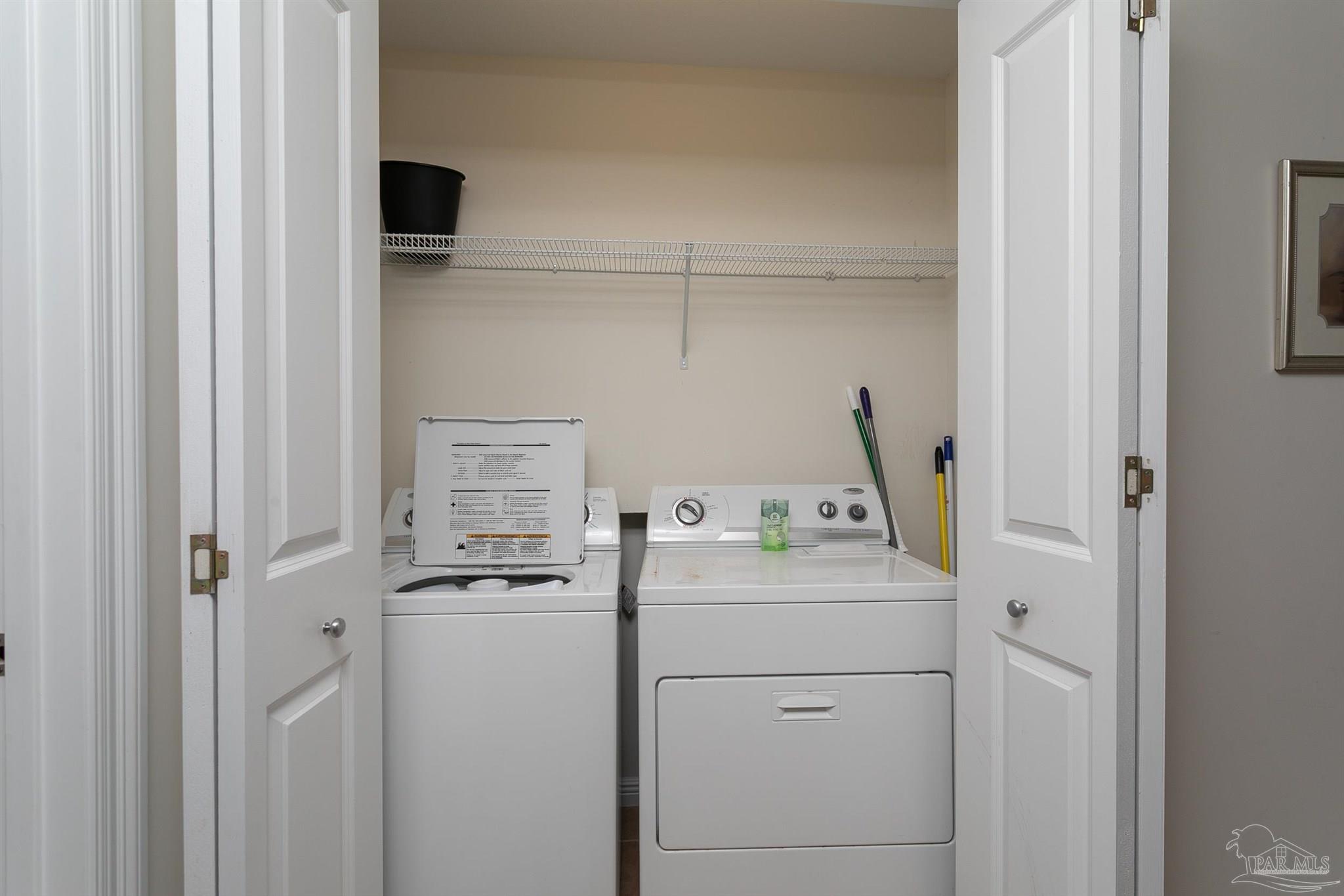 645 Lost Key Drive, Unit 206D Perdido Key, FL 32507 - Photo 21 of 72 a utility room with dryer and washer