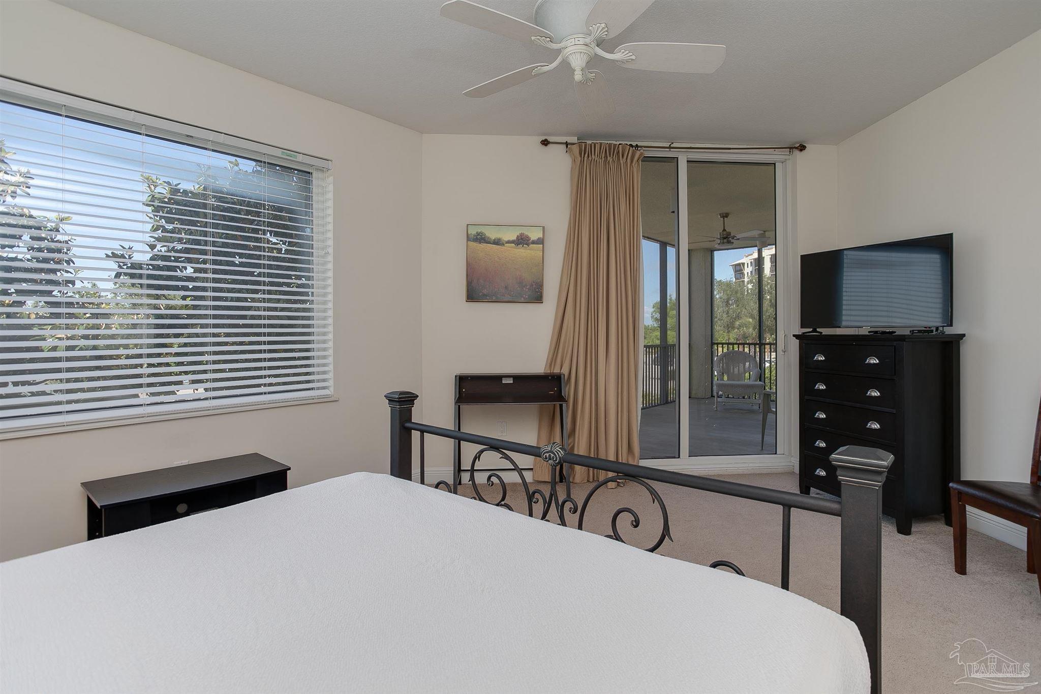 645 Lost Key Drive, Unit 206D Perdido Key, FL 32507 - Photo 24 of 60 a bedroom with a bed and a large window