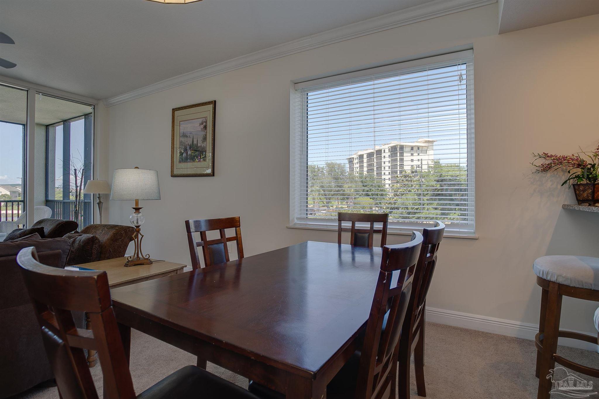 645 Lost Key Drive, Unit 206D Perdido Key, FL 32507 - Photo 33 of 60 a view of a dining room with furniture and window