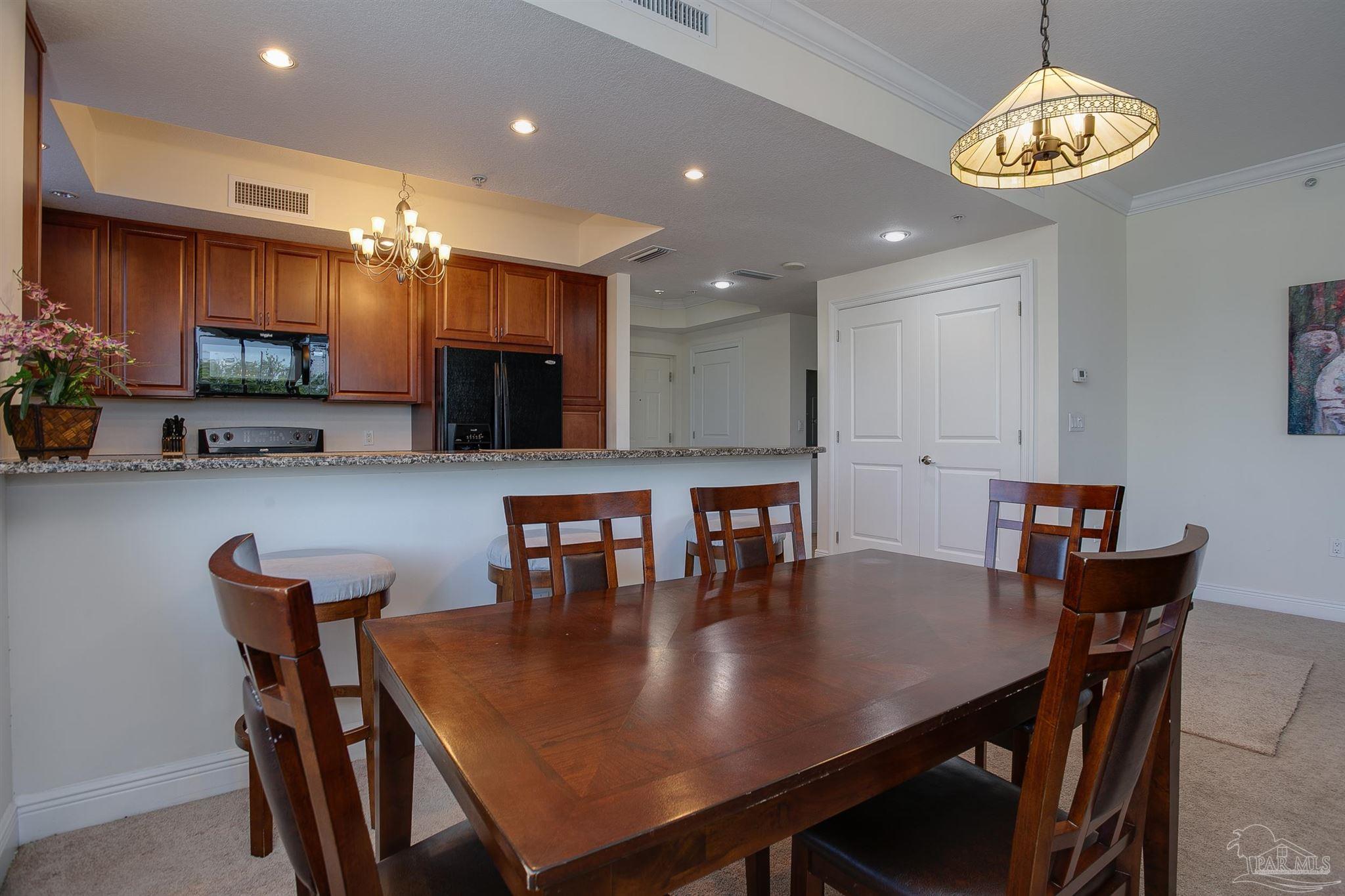 645 Lost Key Drive, Unit 206D Perdido Key, FL 32507 - Photo 34 of 60 a view of a dining room with furniture