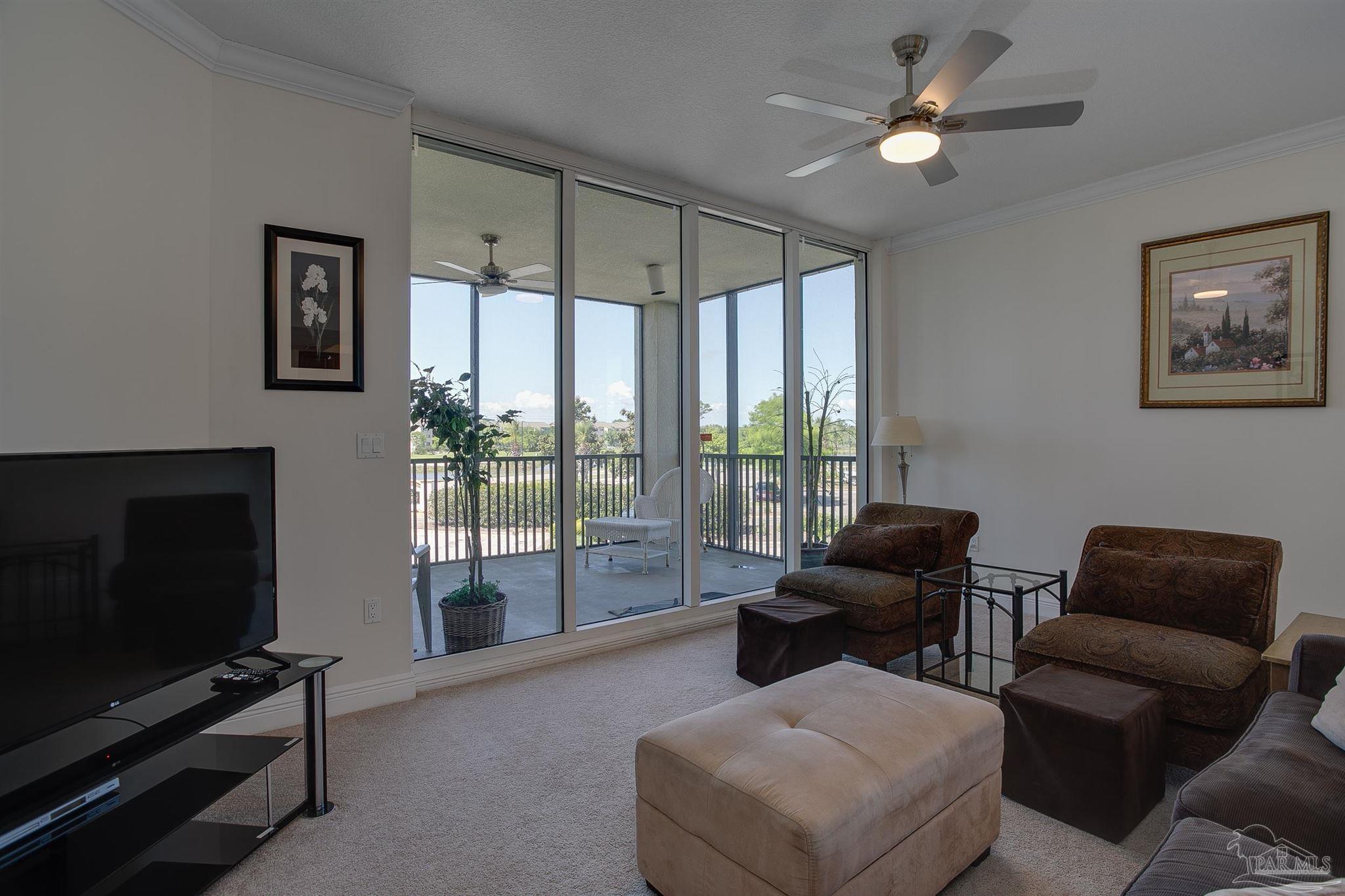 645 Lost Key Drive, Unit 206D Perdido Key, FL 32507 - Photo 37 of 60 a living room with furniture and a flat screen tv