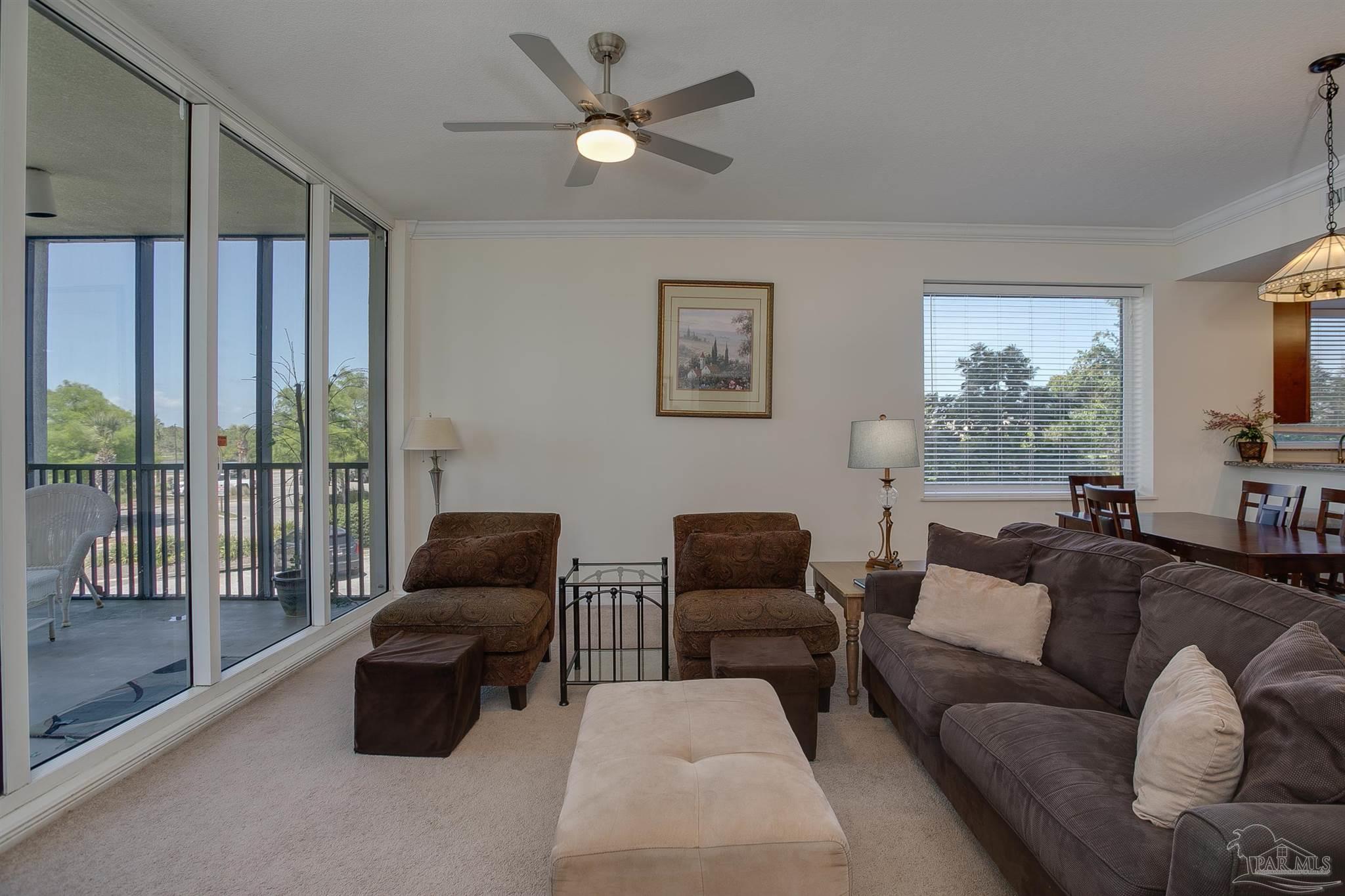 645 Lost Key Drive, Unit 206D Perdido Key, FL 32507 - Photo 38 of 60 a living room with furniture ceiling fan and a window