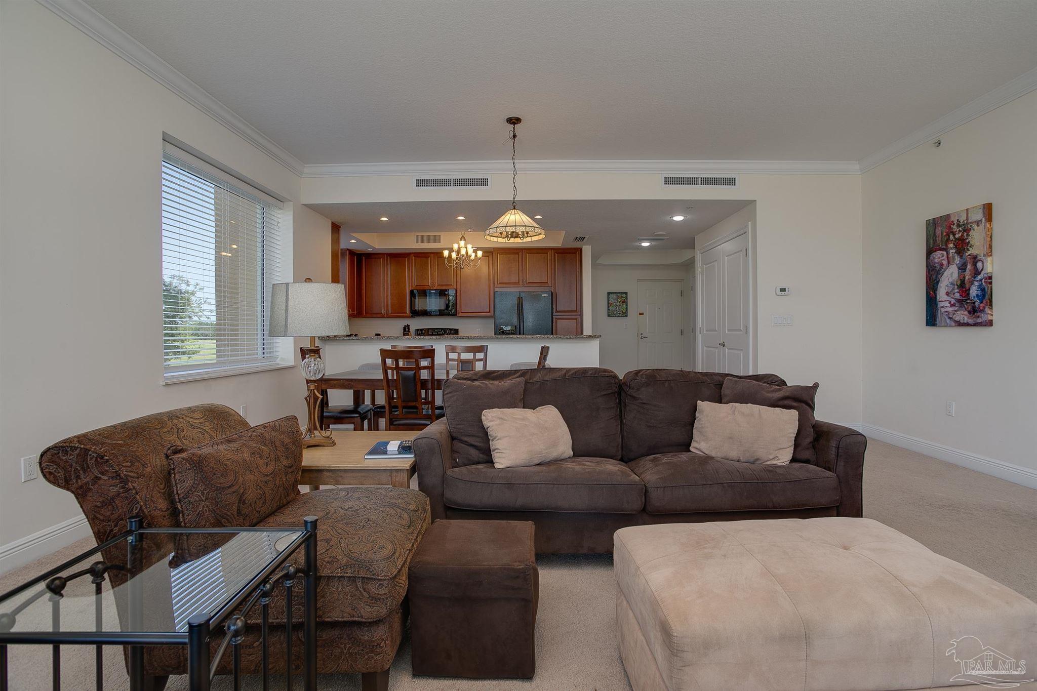 645 Lost Key Drive, Unit 206D Perdido Key, FL 32507 - Photo 40 of 60 a living room with furniture and kitchen view
