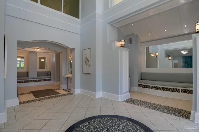 a view of a hallway view with wooden floor and living room
