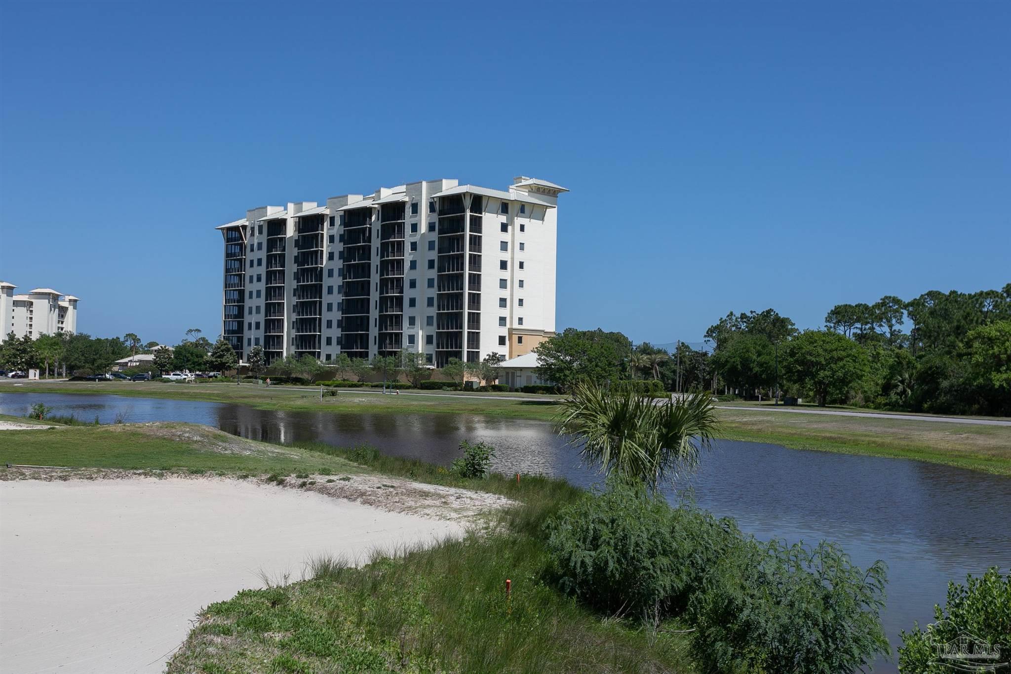 645 Lost Key Drive, Unit 206D Perdido Key, FL 32507 - Photo 4 of 72 a view of building with river in front of it