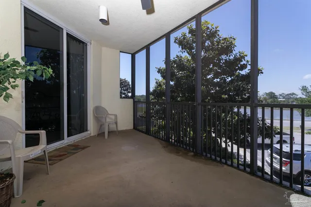 a front view of multi story residential apartment building with yard