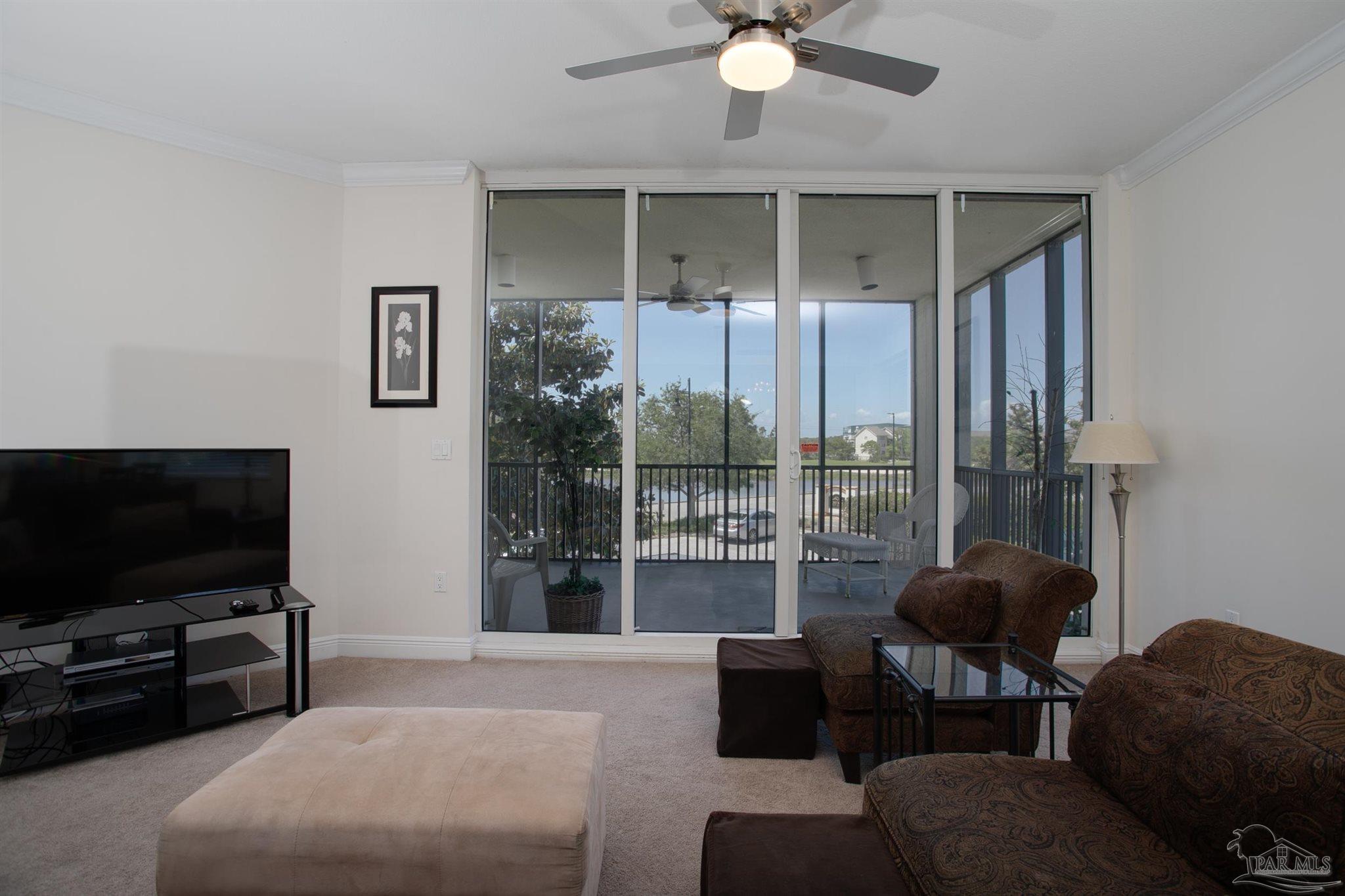 645 Lost Key Drive, Unit 206D Perdido Key, FL 32507 - Photo 41 of 72 a living room with furniture and a flat screen tv