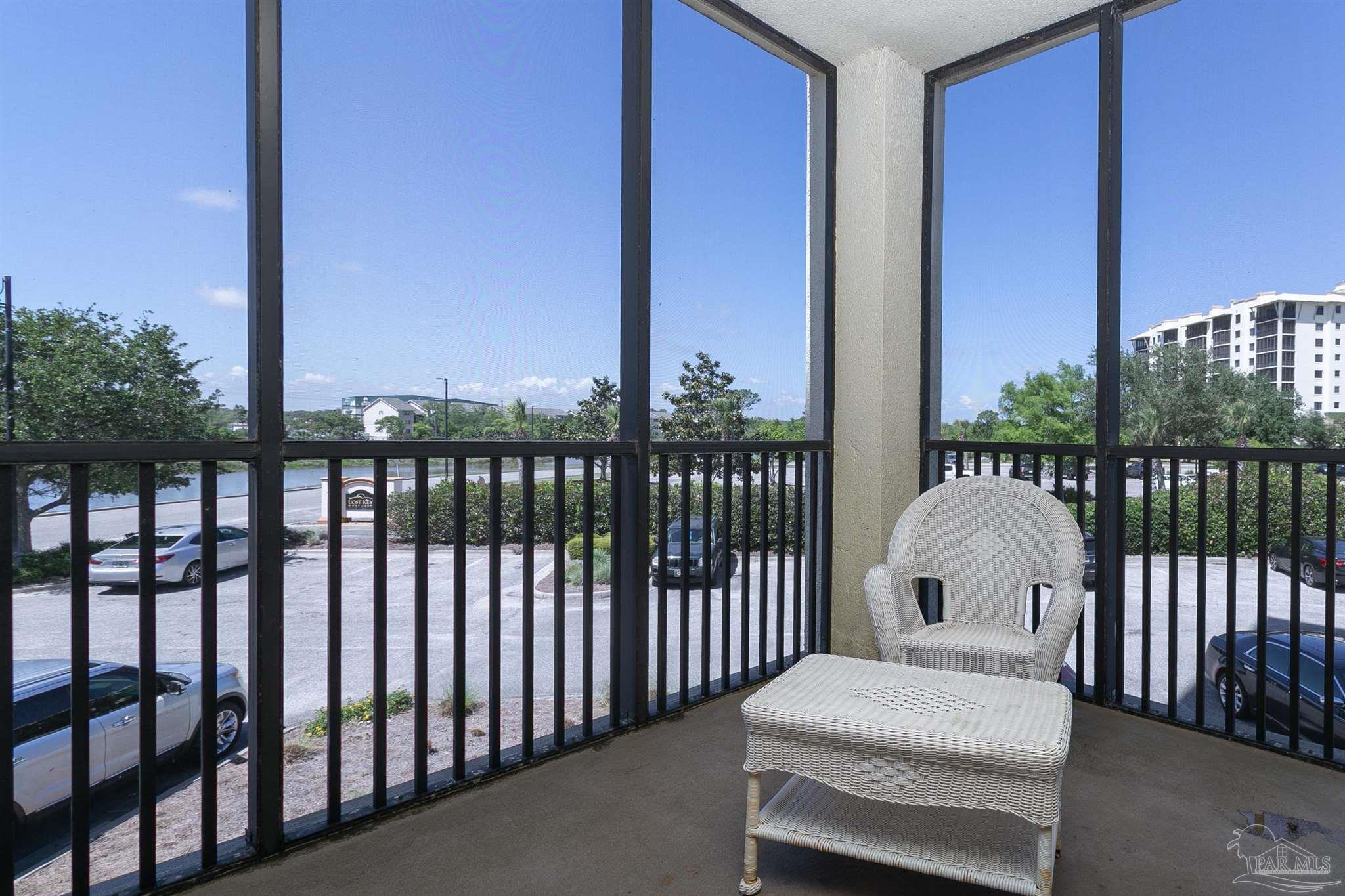 645 Lost Key Drive, Unit 206D Perdido Key, FL 32507 - Photo 45 of 72 a bedroom with a bed and wooden floor