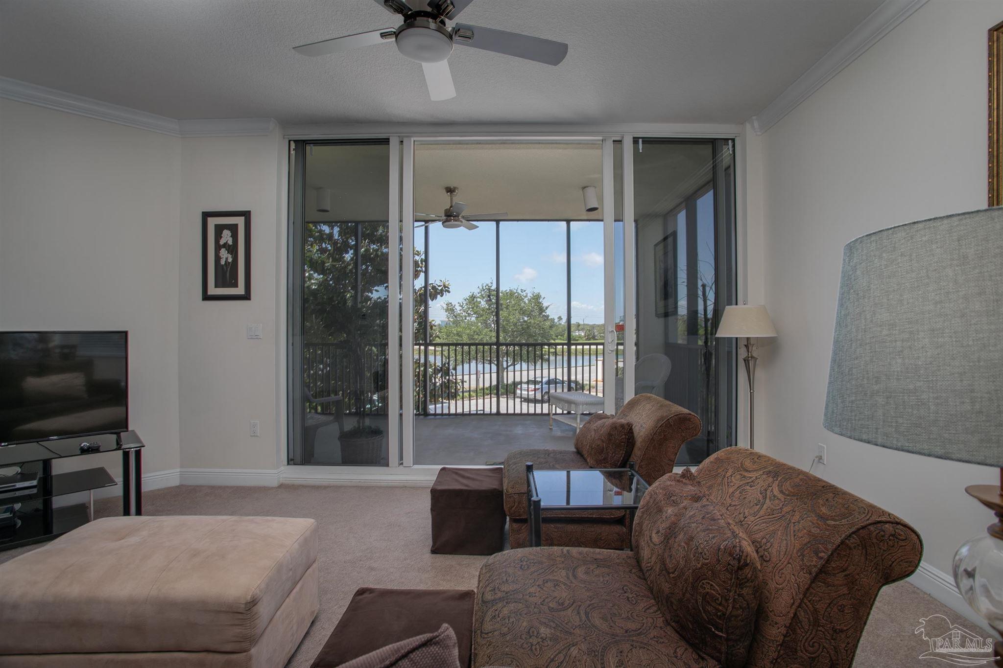 645 Lost Key Drive, Unit 206D Perdido Key, FL 32507 - Photo 50 of 72 a living room with furniture and a flat screen tv