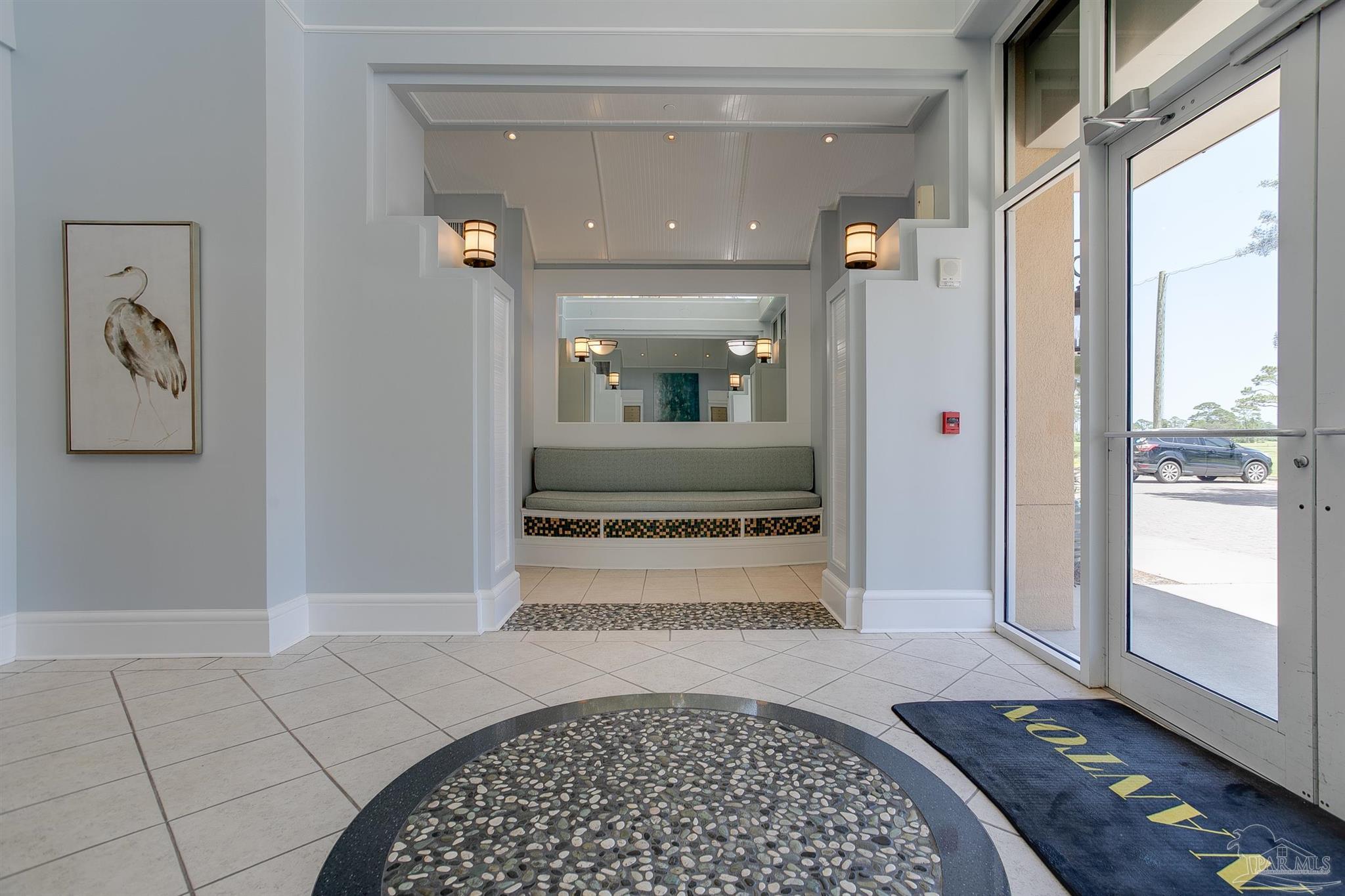 645 Lost Key Drive, Unit 206D Perdido Key, FL 32507 - Photo 5 of 60 a view of a hallway view with wooden floor and living room