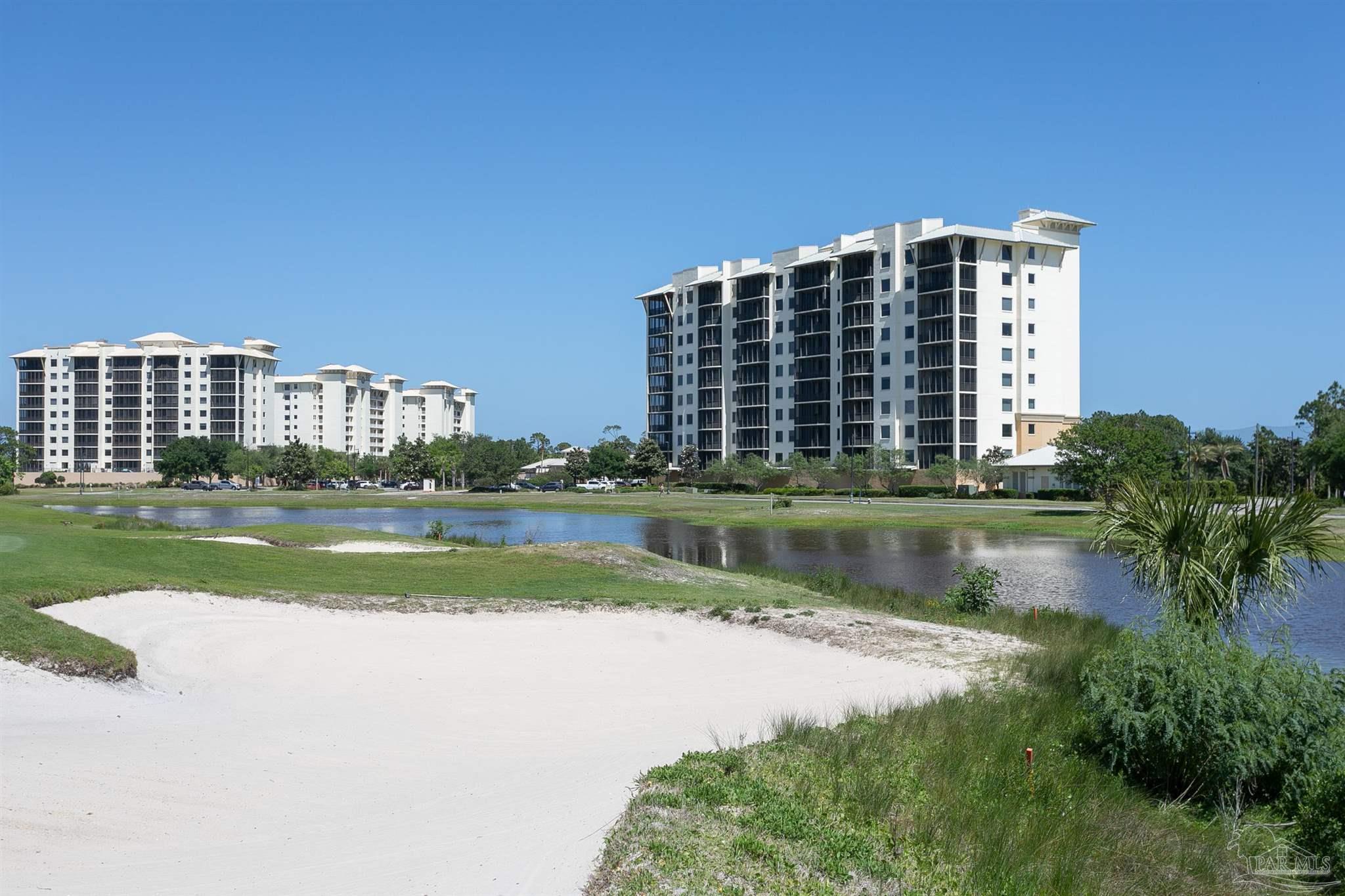 645 Lost Key Drive, Unit 206D Perdido Key, FL 32507 - Photo 55 of 72 a view of building with river in front of it