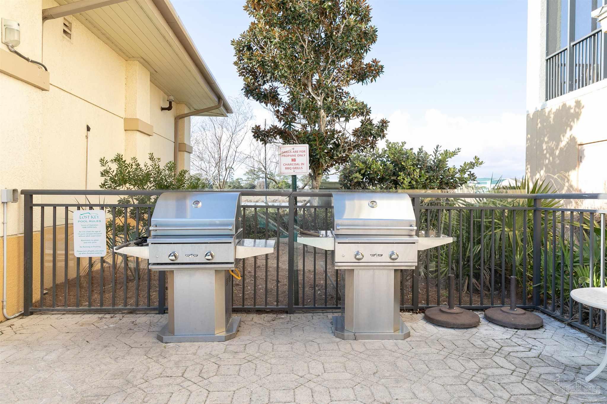 645 Lost Key Drive, Unit 206D Perdido Key, FL 32507 - Photo 57 of 60 a utility room with washer and dryer