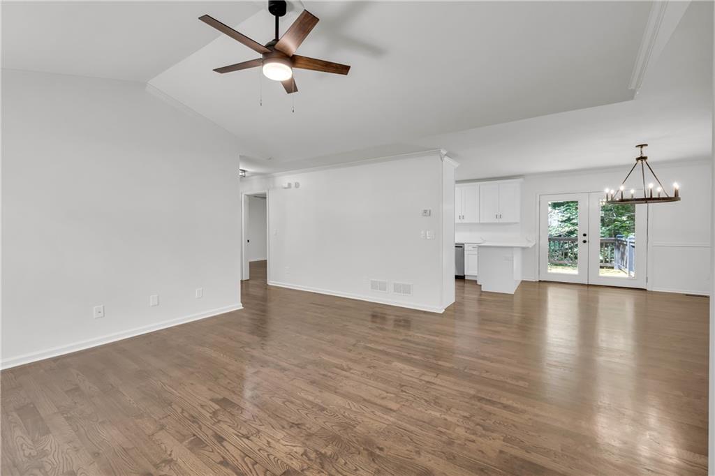 2941 Lake Hollow Road Gainesville, GA 30501 - Photo 7 of 53 a view of empty room with wooden floor and ceiling fan