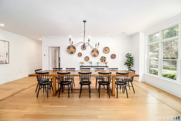 a view of a dining room with furniture window and outside view