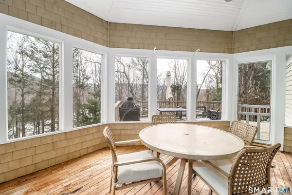a view of a dining room with furniture window and outside view