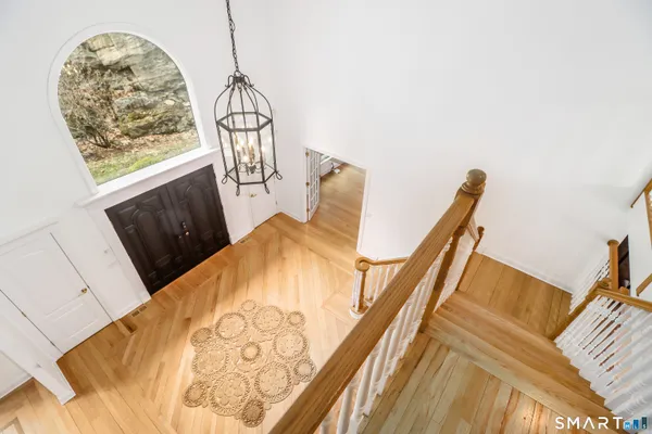 a view of staircase with white walls