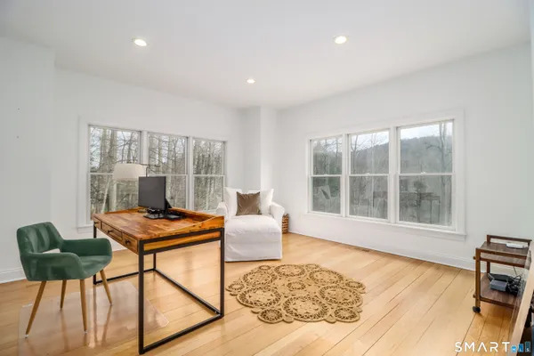 a living room with furniture and a window