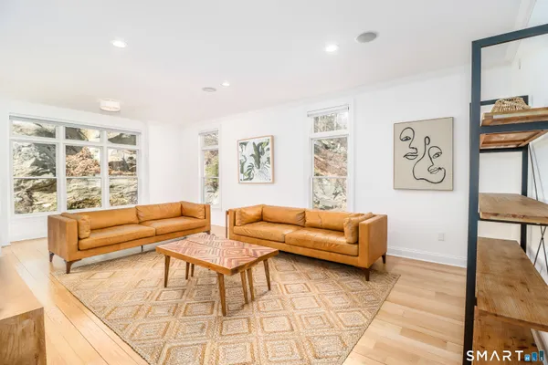 a living room with furniture and a large window