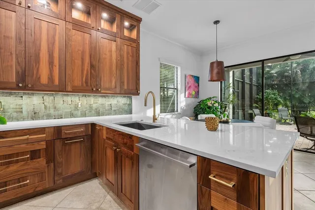 a kitchen that has a lot of cabinets in it