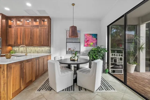 a utility room with sink dryer and washer
