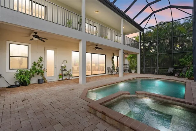 a view of swimming pool with outdoor seating