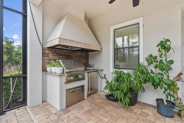 a living room with furniture stairs and a large window