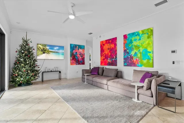 a living room with a large window table and chairs