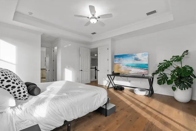 a spacious bathroom with a granite countertop sink a mirror and a bathtub