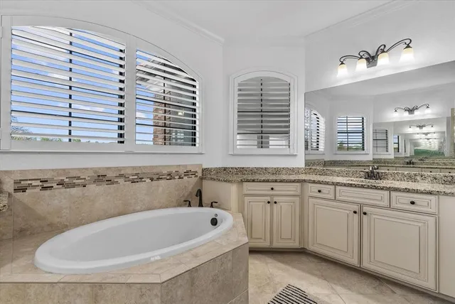 a bathroom with a granite countertop shower mirror and a sink