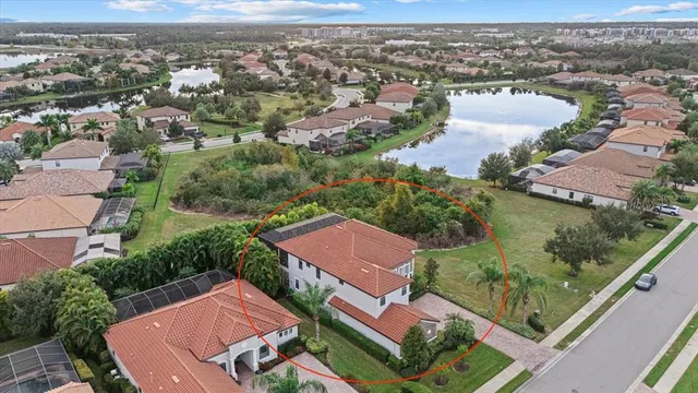 a swimming pool with lots of tress in the background