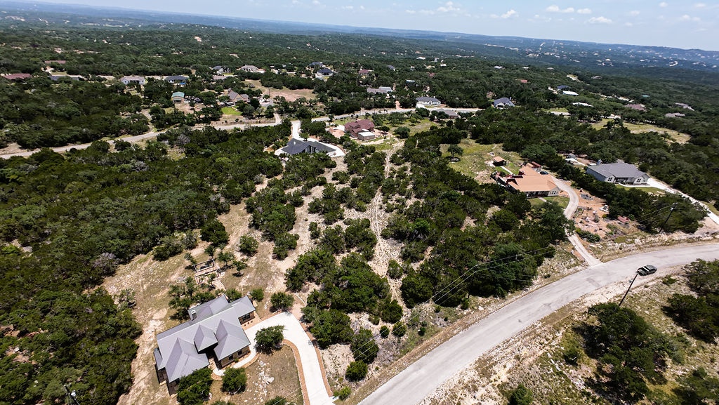 841 Rutherford Fischer, TX 78623 - Photo 8 of 22 an aerial view of residential houses with city view