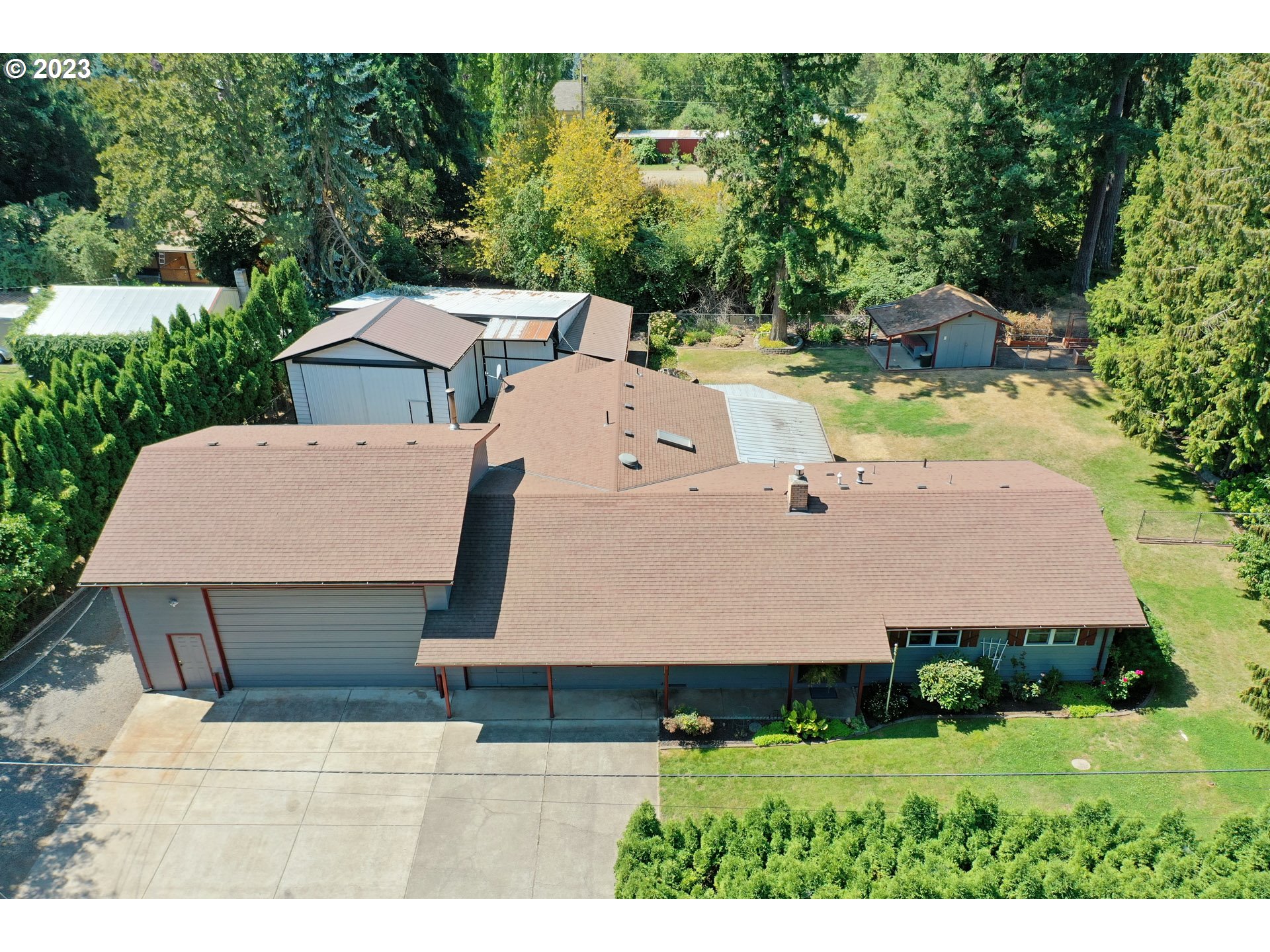 5685 Southwest River Road Hillsboro, OR 97123 - Photo 2 of 46 a aerial view of a house with yard and green space