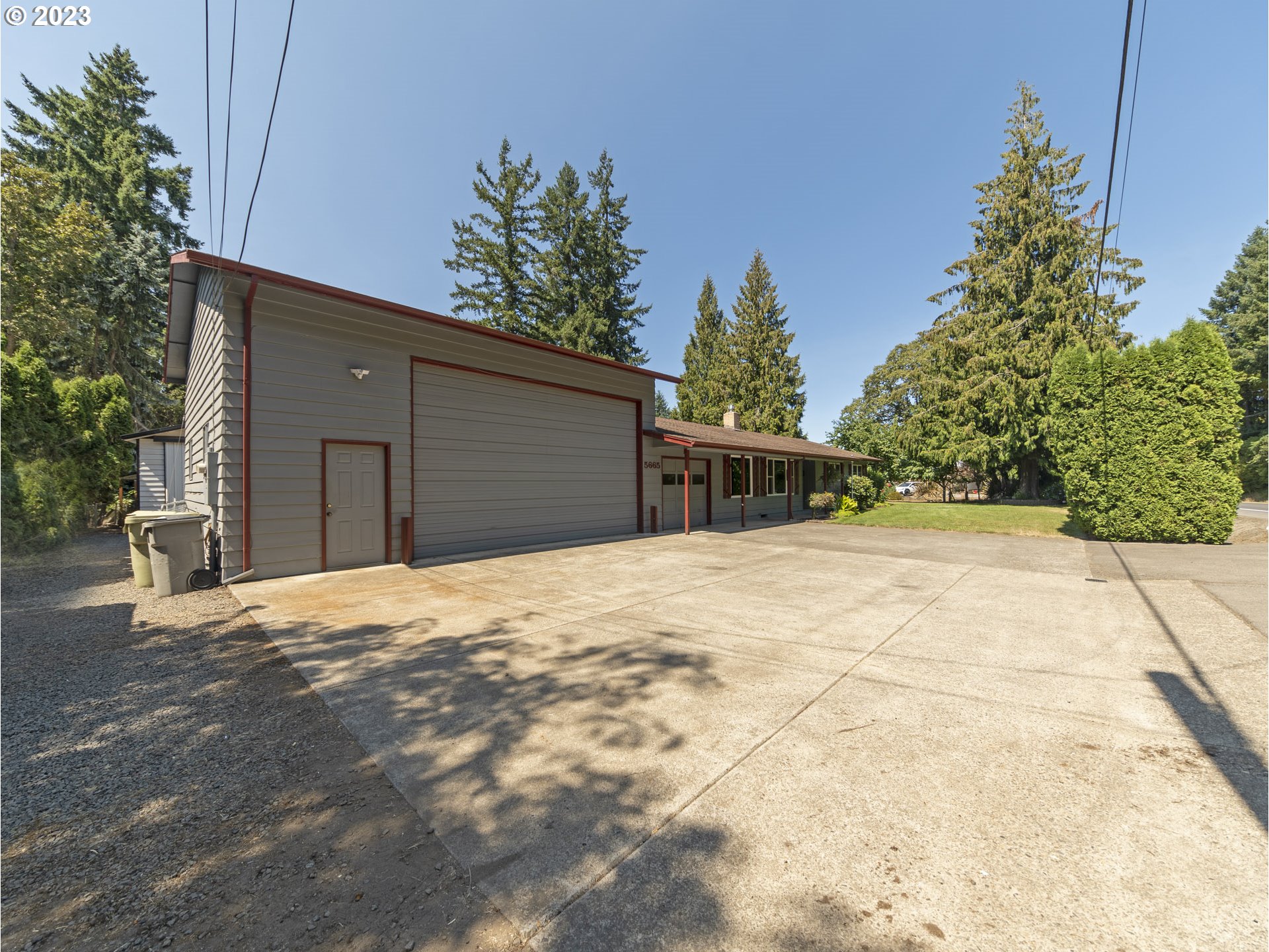 5685 Southwest River Road Hillsboro, OR 97123 - Photo 35 of 46 a house with trees in front of it